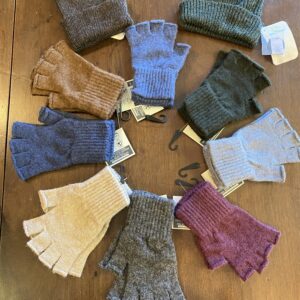 A display of fingerless Alpaca gloves and two Alpaca hats.